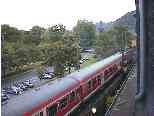 Another passenger train blasts past our window...