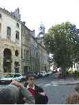 Belgian style clock tower in Beaune.  (That's Marie, our local guide.)