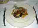 Lamb chops accompanied by eggplant cake