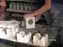 packing the mold with clay