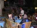 fellow travellers enjoy a Taormina cafe, complete with live music